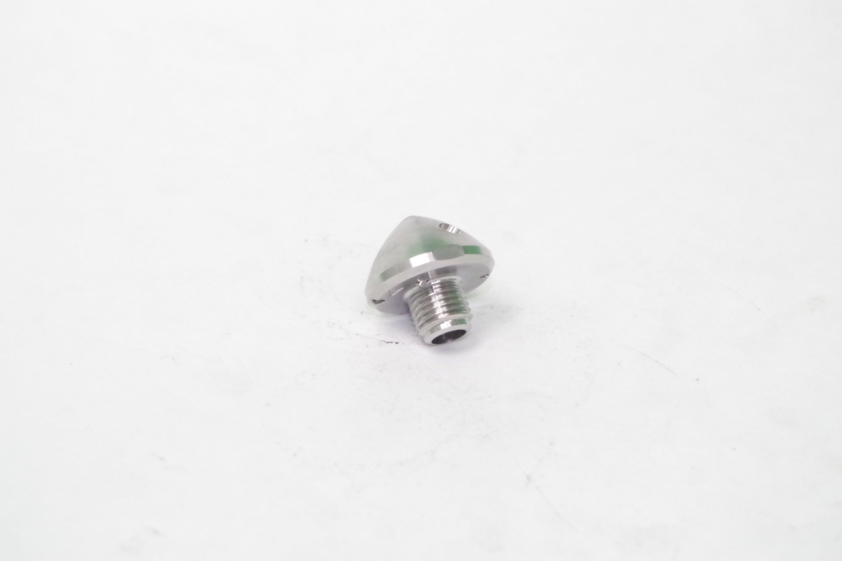 Metallic screw on a white background
