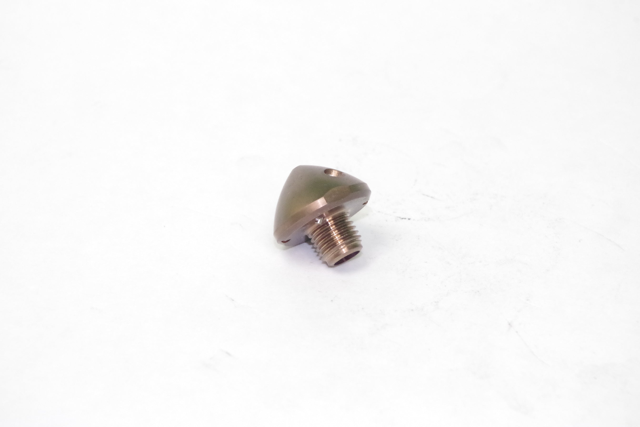 Metallic cone-shaped object on a white background