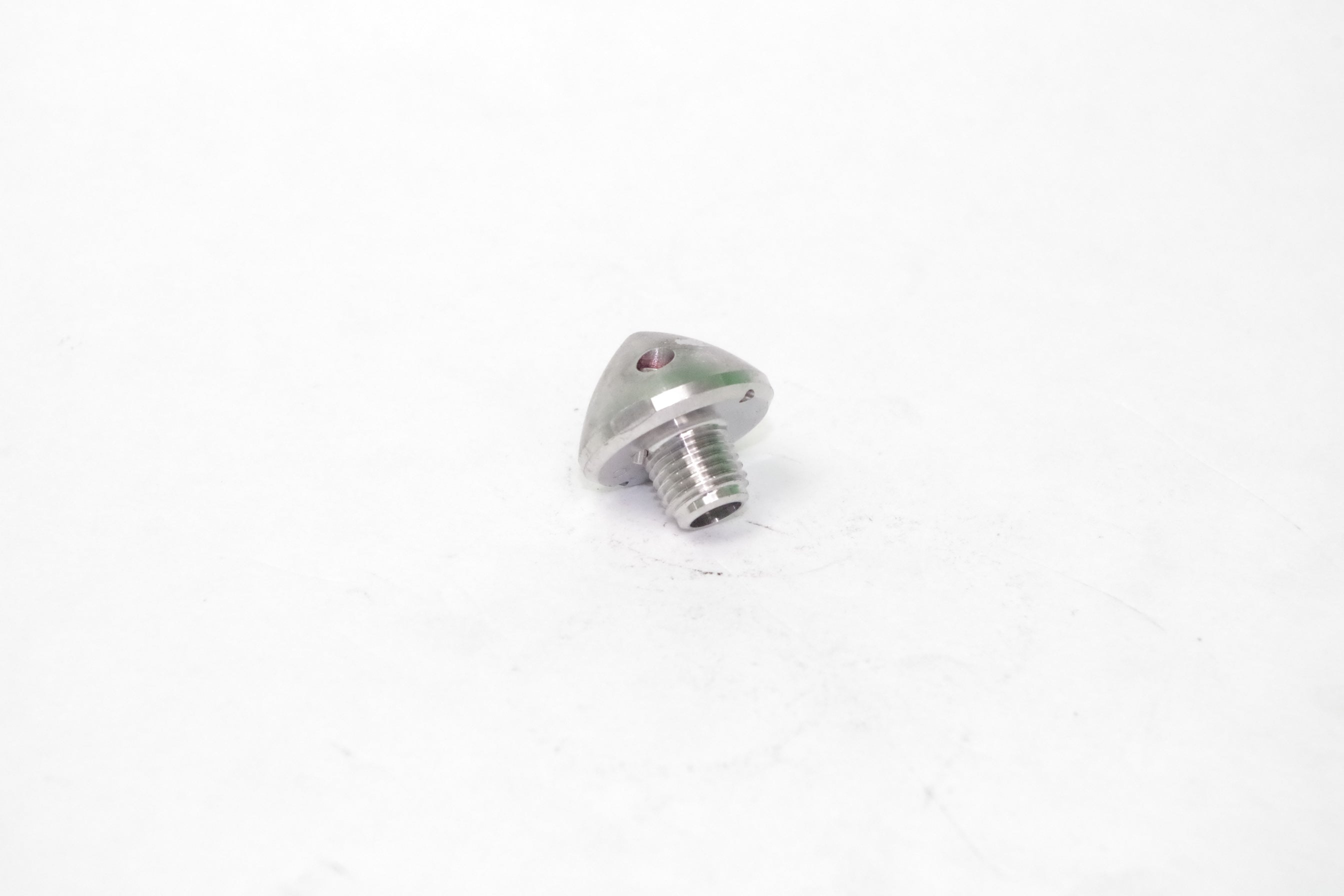 Metallic screw on a white background