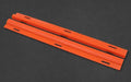 Two orange plastic strips on a black background