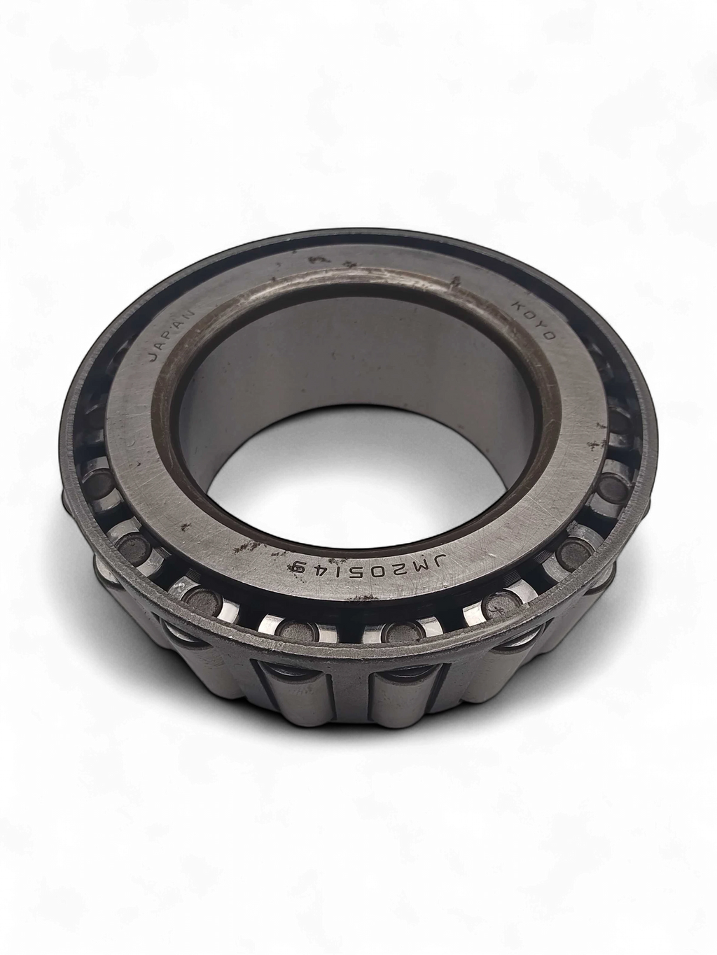 Range Supply Koyo tapered roller bearing for FMC Bean L-0614 pump power assembly, showing metal construction and markings.