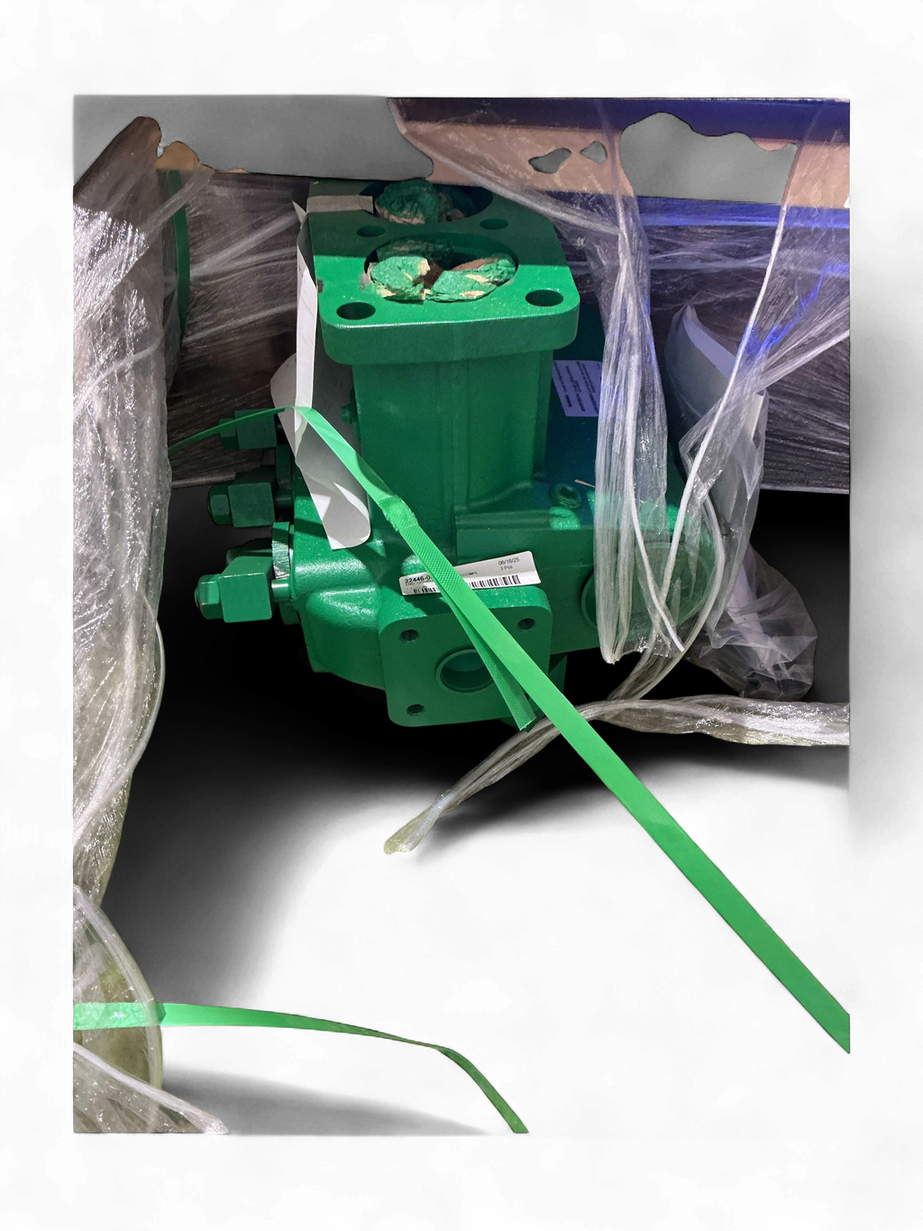 Range Supply Myers D65-20 water pump fluid end component in green finish, wrapped in protective plastic for shipping.