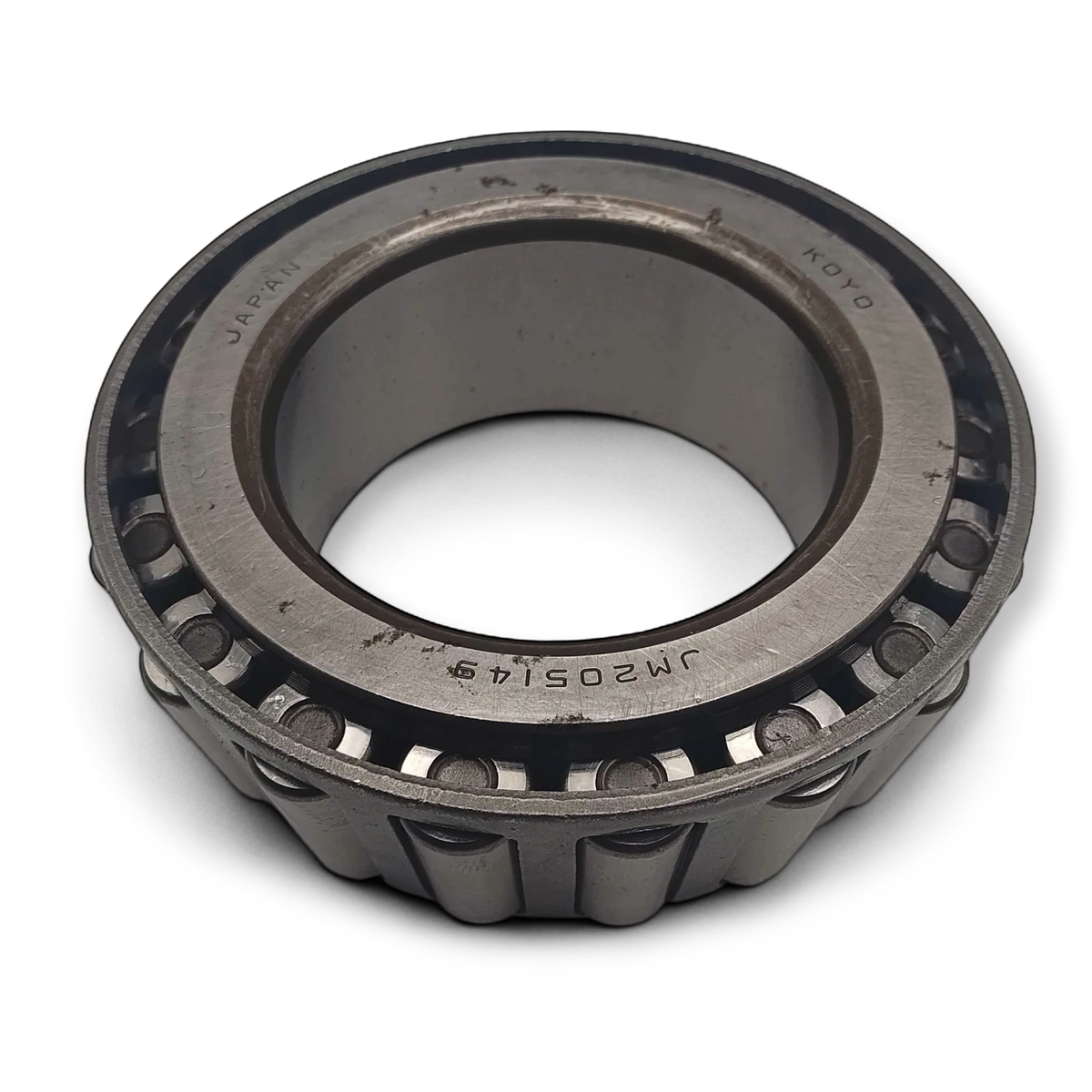 Sewershop Koyo tapered roller bearing for FMC Bean L-0614 pump power assembly, showing metal construction and markings.
