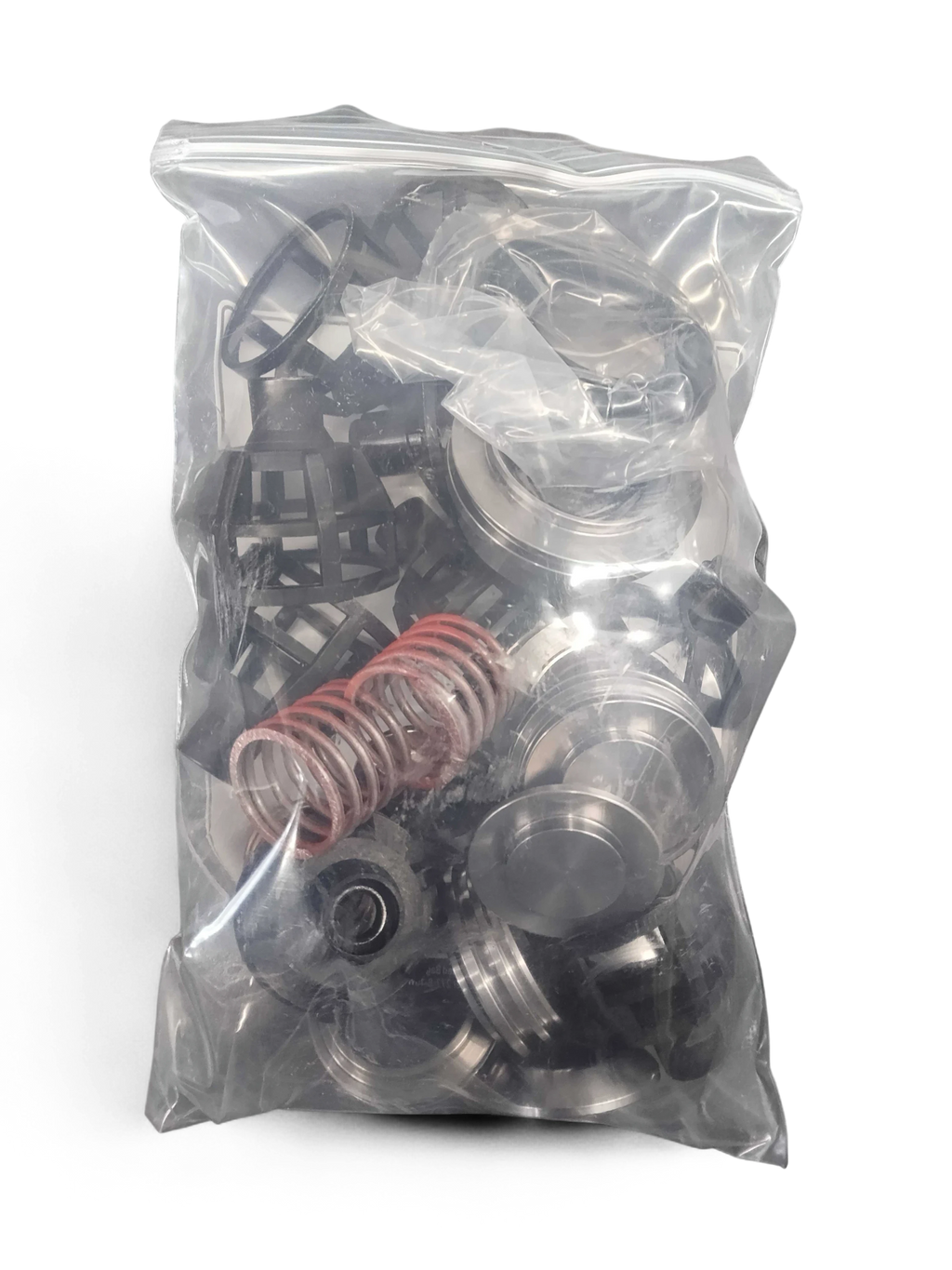 Sewershop GP5142 giant pump rebuild kit containing metal valve assemblies, springs, and seals in a plastic bag
