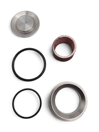 Sewershop GP5142 pump rebuild kit components including metal valve parts, springs, and black rubber O-ring seals.
