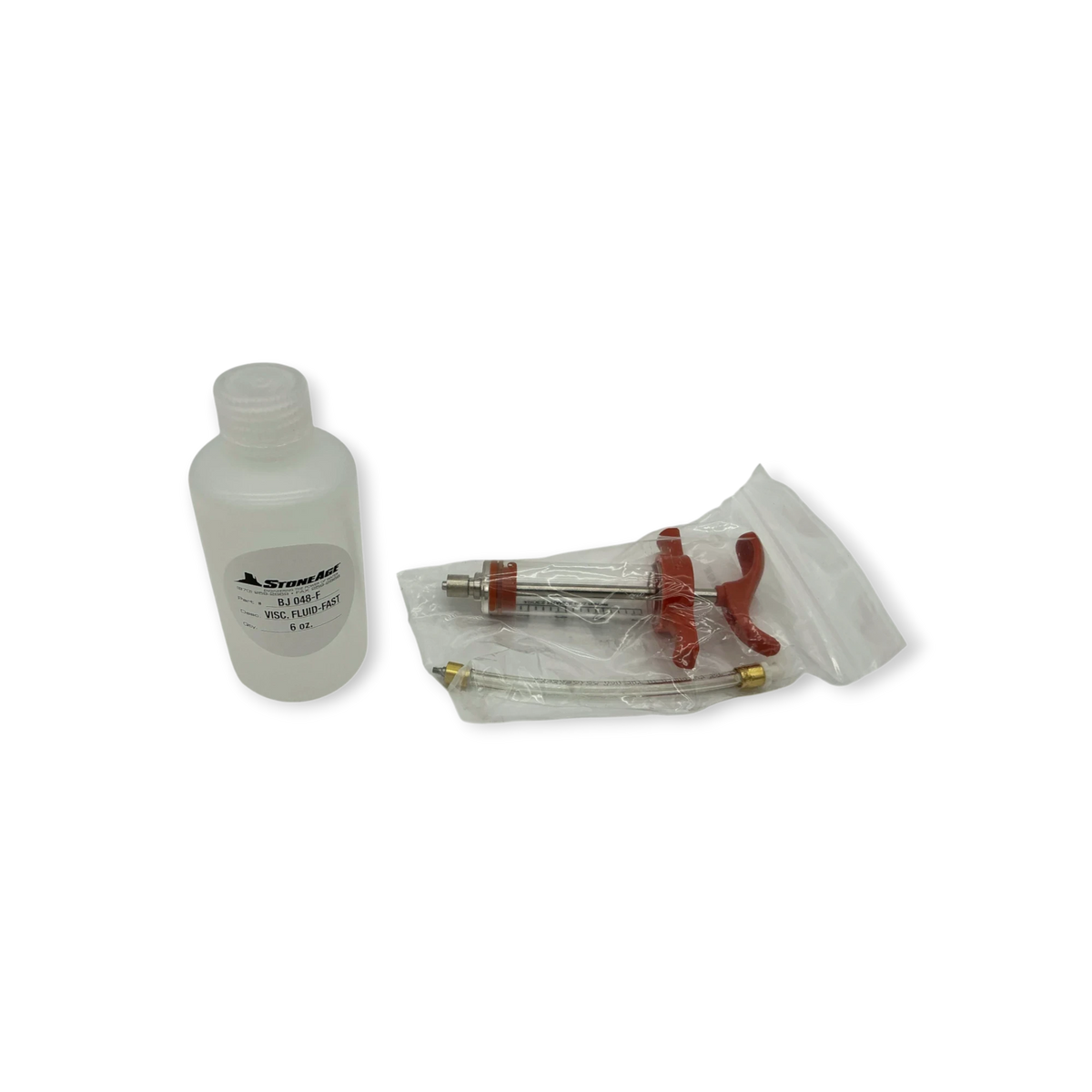 Sewershop Warthog WH nozzle rebuild kit featuring a fluid bottle and a red manual grease injector tool